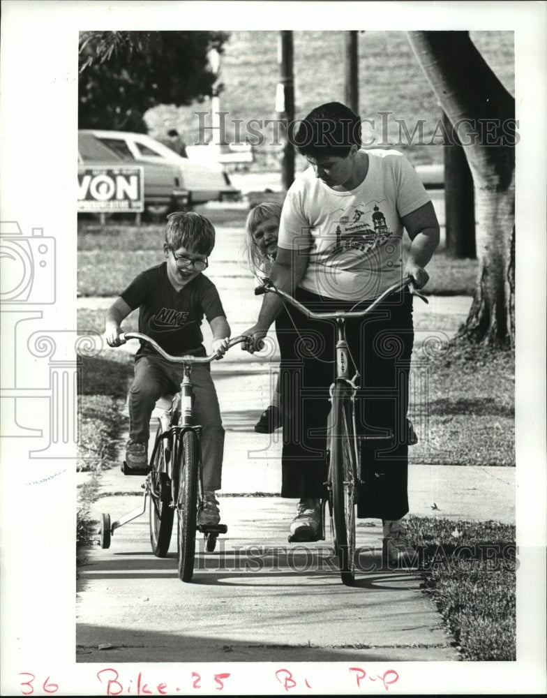 Adam Arseneaux Learns to Ride a Bicycle with Elaine Danner - Historic Images