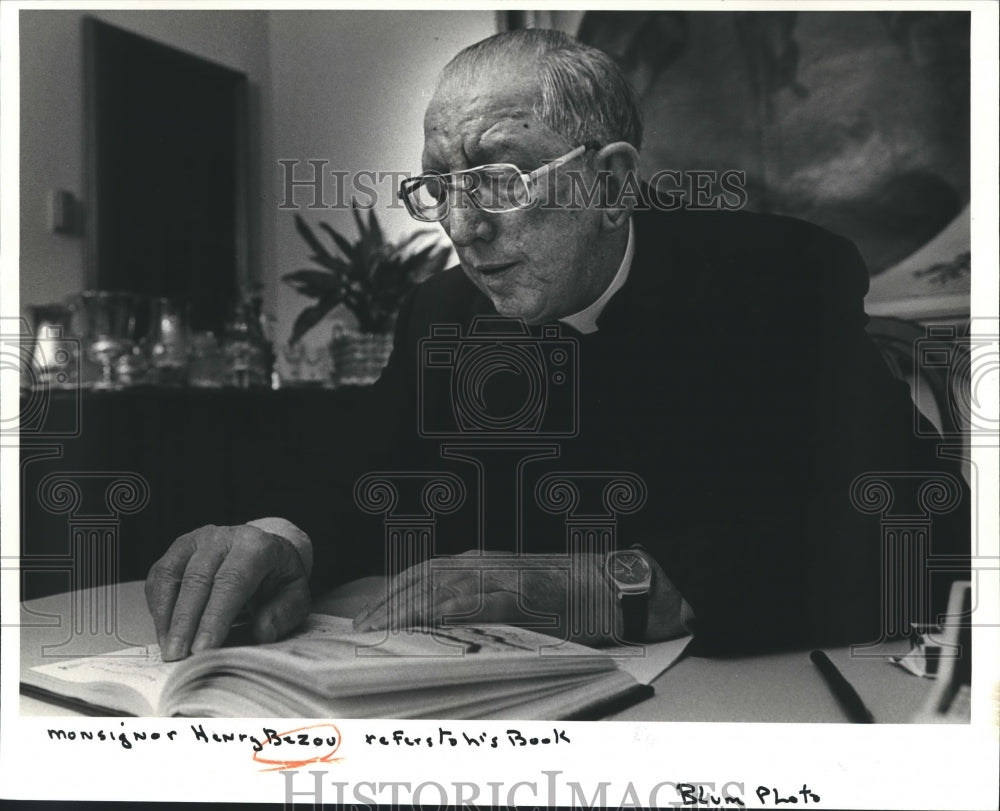 Monsignor Henry Bezou Refers to his Book - Historic Images