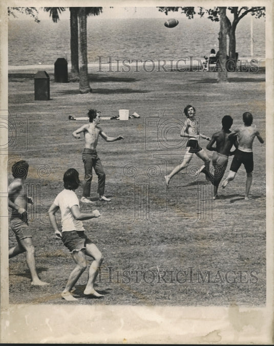 Press Photo Men Playing American Football at a Park - noa38493 - Historic Images