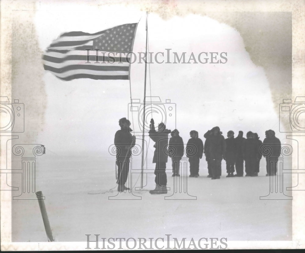 1966 Byrd Station Residents raise the American Flag in Antarctica - Historic Images