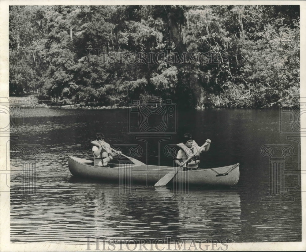 1975 Two youngsters sailing in a boat on a lake at Camp Salmen-Historic Images