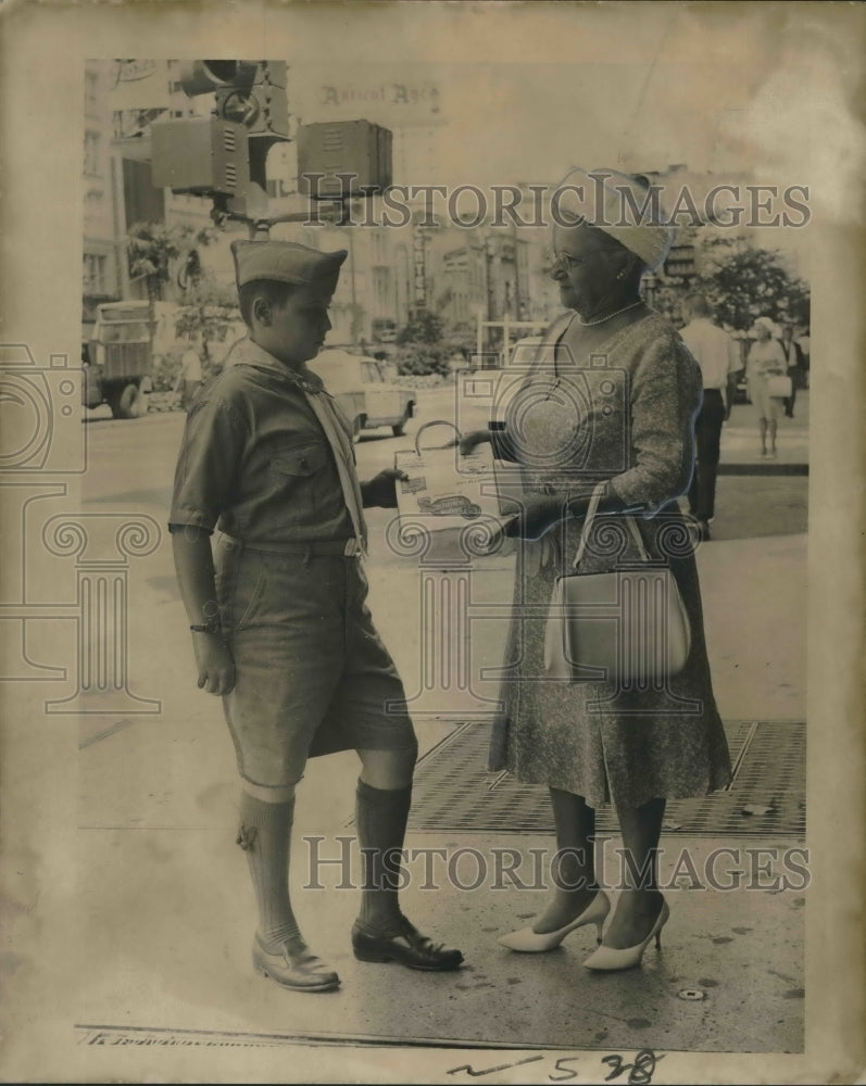 1967 Press Photo Boy Scout Hands Out Litter Bag at Canal Street Cleanup Campaign-Historic Images