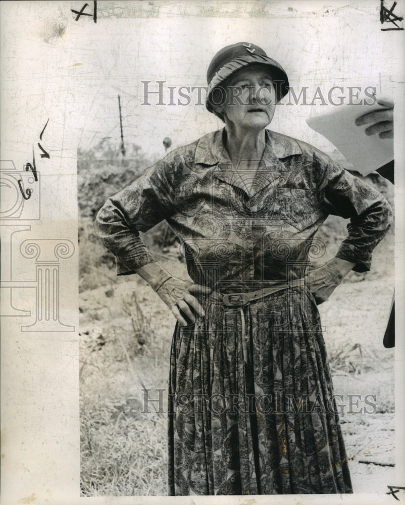 1963 Mrs. John Colas stands along her demolished house-Historic Images