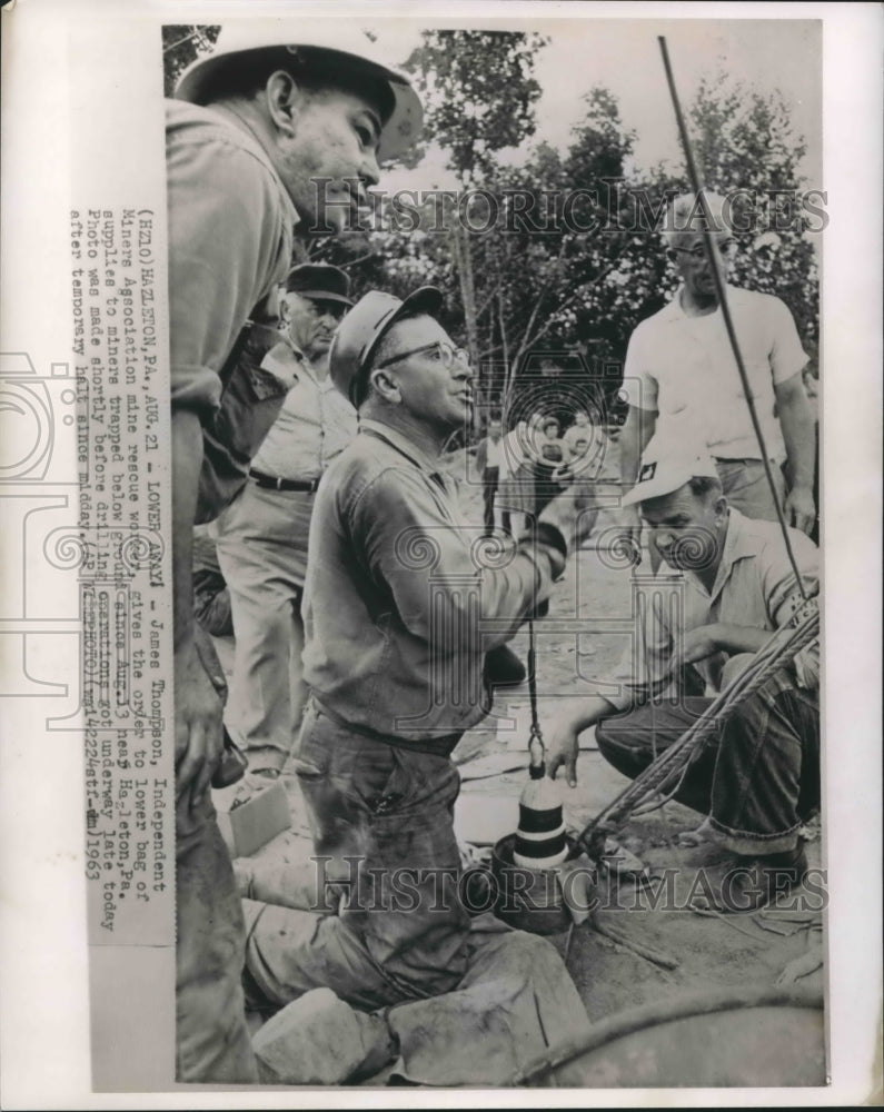 1963 Press Photo James Thompson, mine rescue worker, okays lowering of supplies-Historic Images