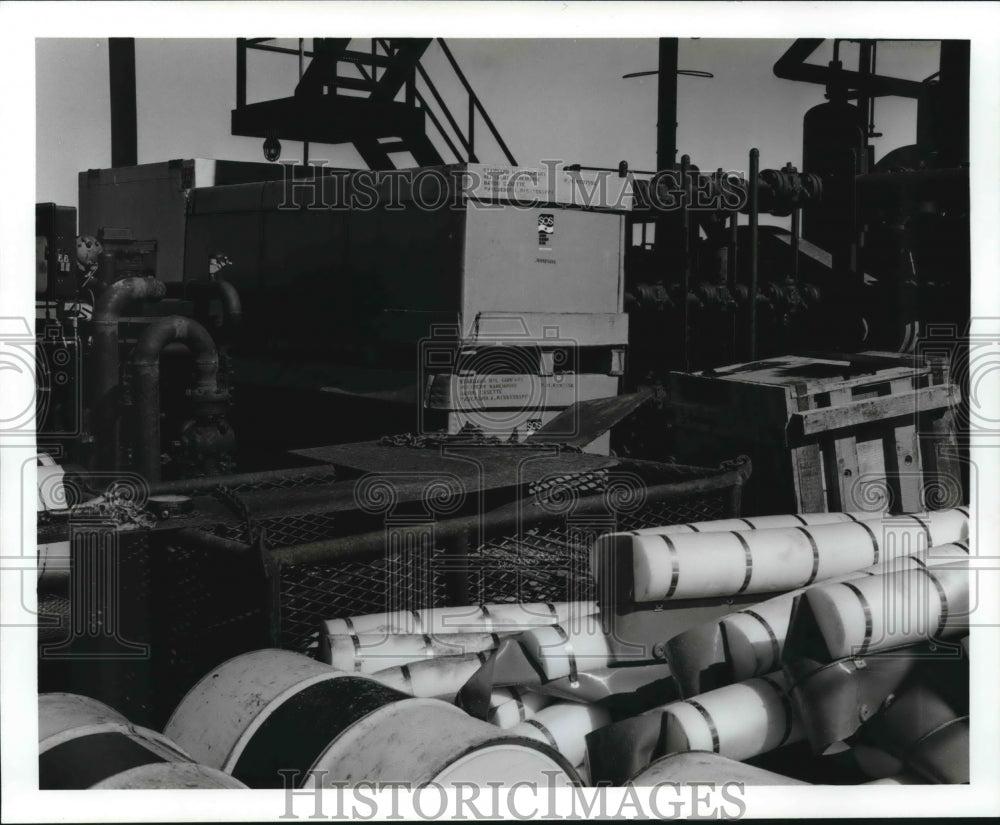 1970 Press Photo Tumbled barrels and debris at Chevron Oil Company. - Historic Images