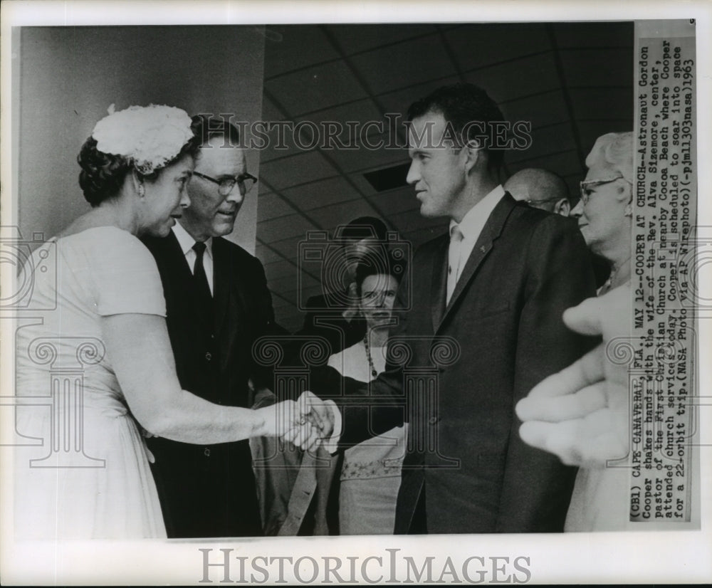 1963 Astronaut Gordon Cooper shakes hands with Reverend&#39;s wife - Historic Images