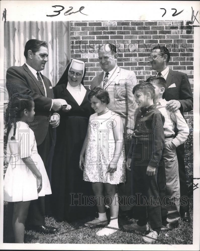 1968 Peter J. Compagno gives check for St.Michael Special School - Historic Images