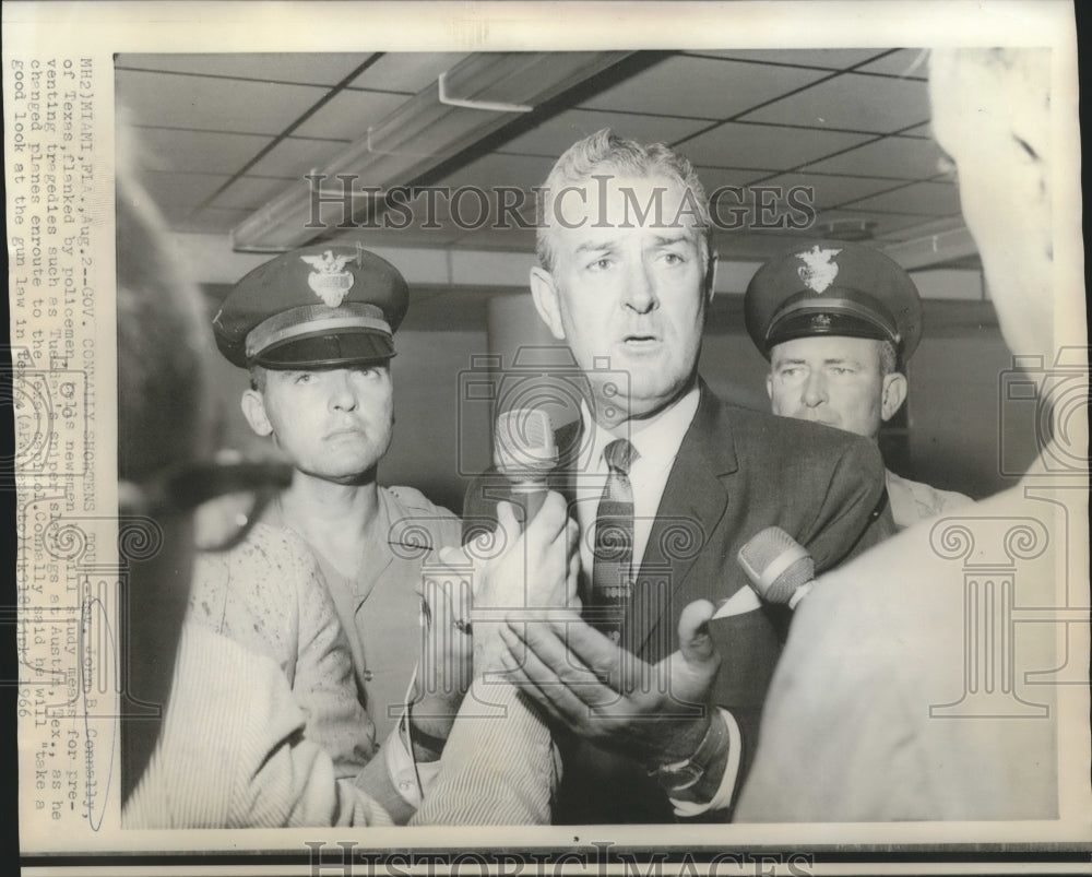 1966 Press Photo John B. Connolly, of Texas, flanked by policemen, with Newsmen - Historic Images