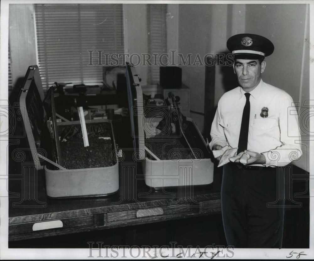 1969 Customs Inspector William Cousins finds narcotics in suitcase - Historic Images