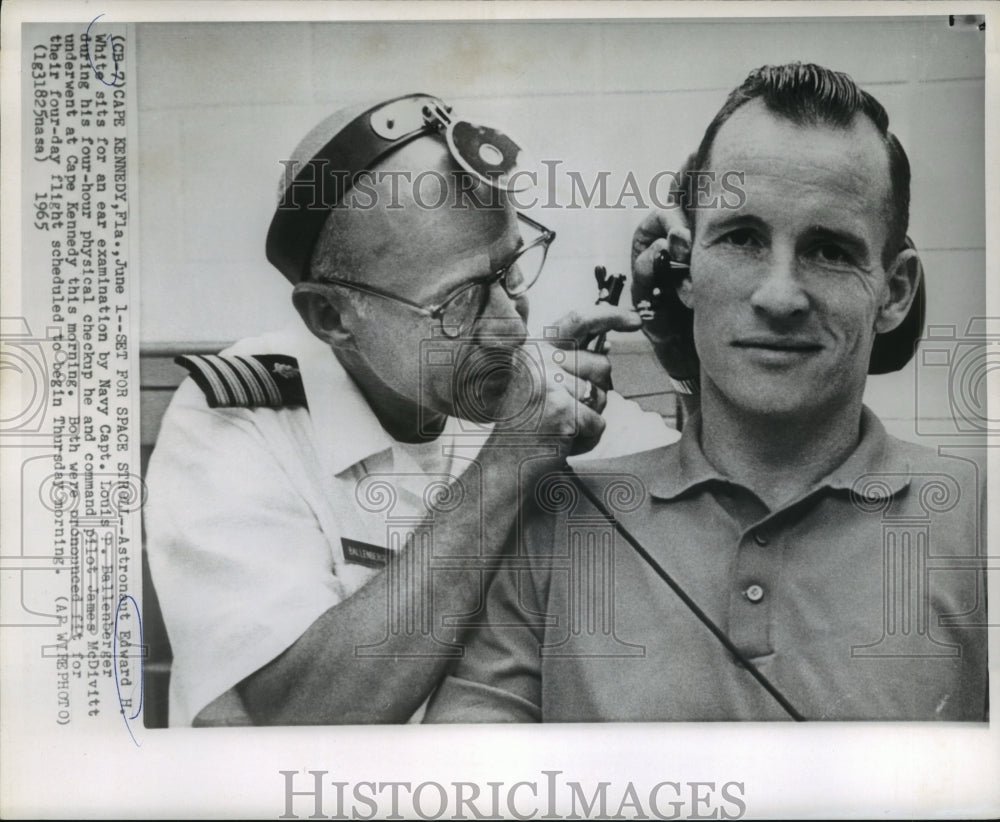 1965 Press Photo Edward White has ear examination by Captain Louis Bellenberger-Historic Images