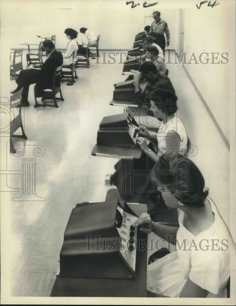 1965 Press Photo Applicants are using question-and-answer computers for testing.-Historic Images