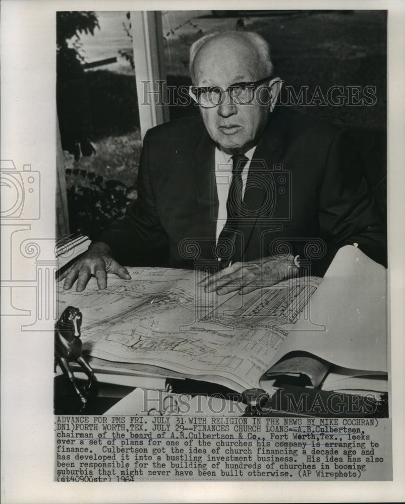 1964 Press Photo A.B. Culbertson looks church plans his company will finance.-Historic Images
