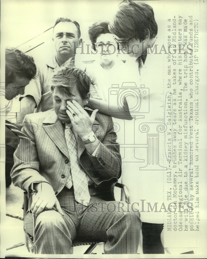 1970 Francis W. Dalgleish wipes tears as he leaves for Australia - Historic Images