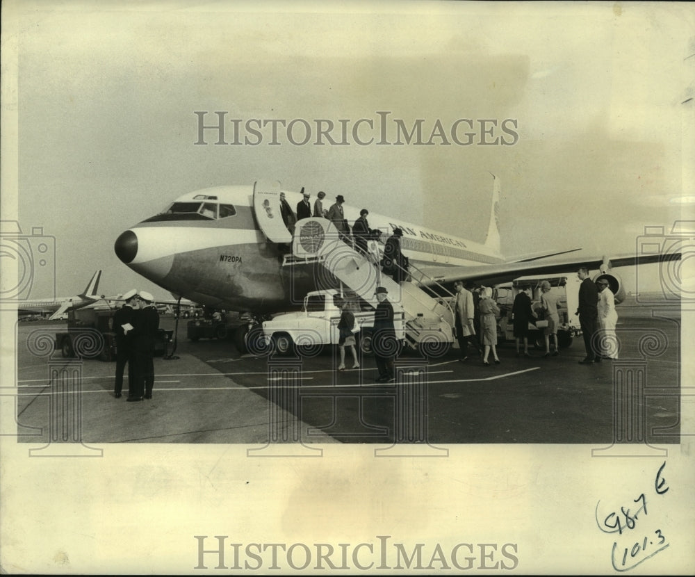 1967 Passengers hurry off an airplane toward custom check - Historic Images