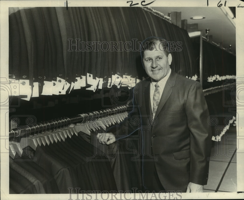 1966 Max Gillman, sales manager for Steins shows his stock of suits. - Historic Images