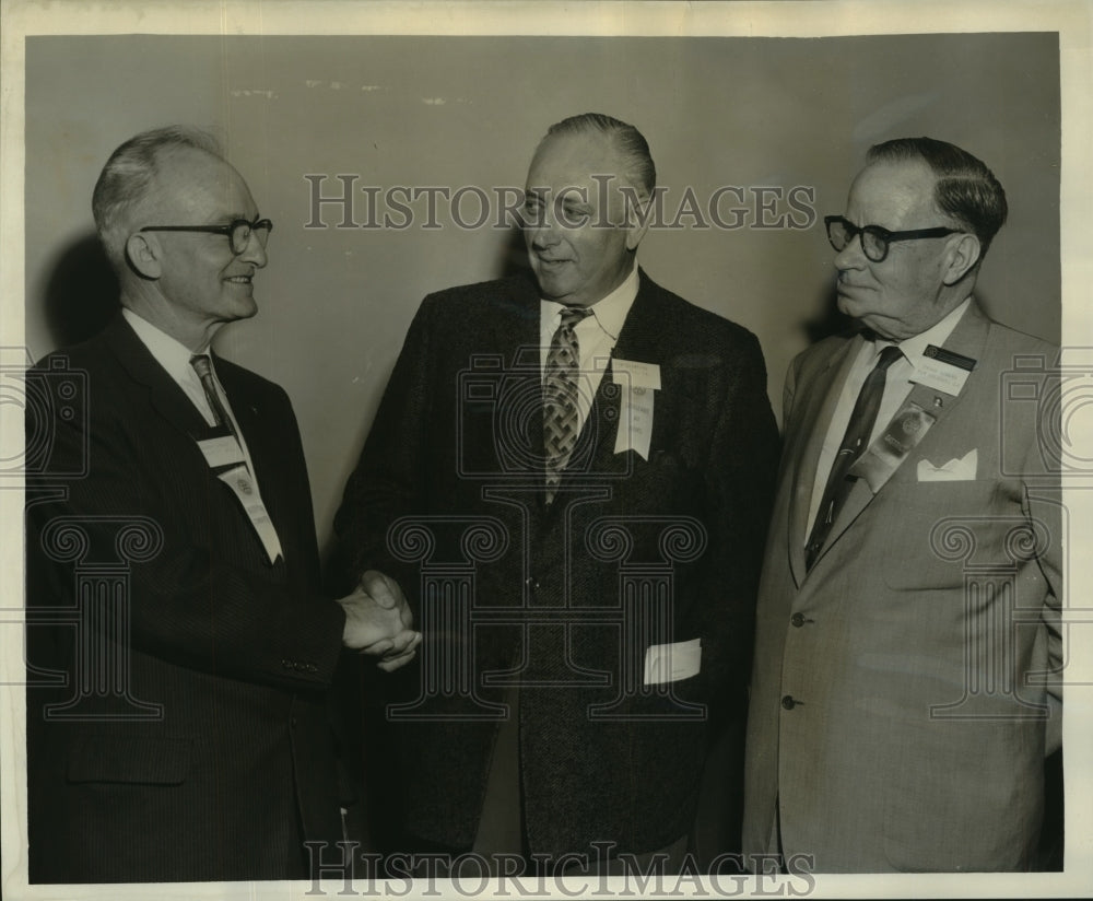 1960 Officials discuss Rotary International District Governor-Historic Images