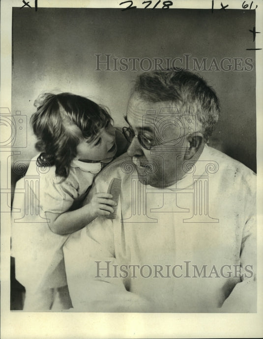 1963 Press Photo Doctor A.R. Dafoe, who delivered the babies, and Marie-Historic Images