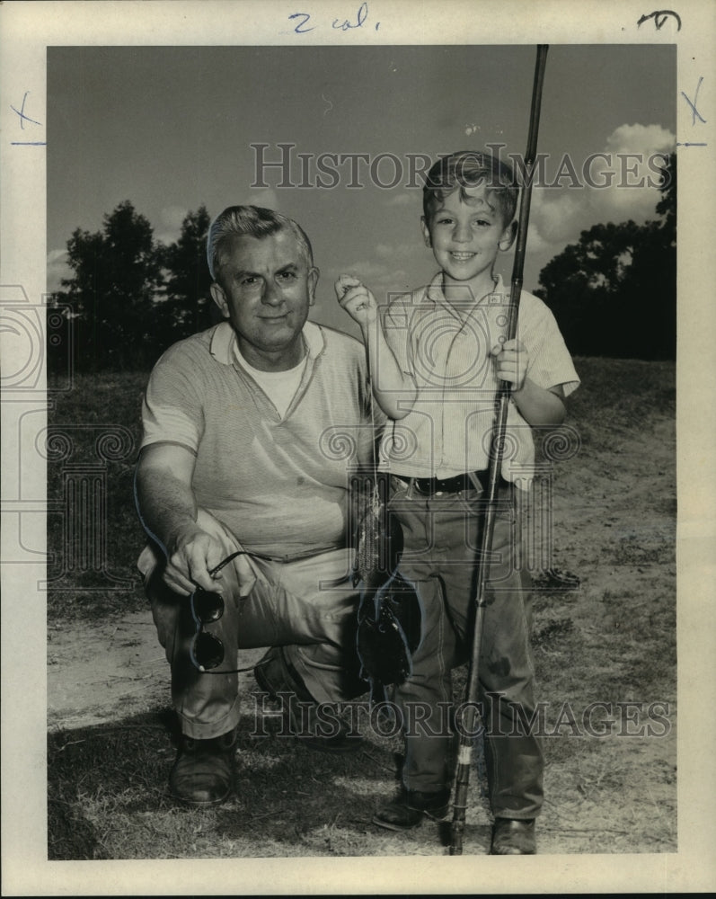 1965 Press Photo Alfred Vidal Davis proud of his son&#39;s first bream fish catch-Historic Images