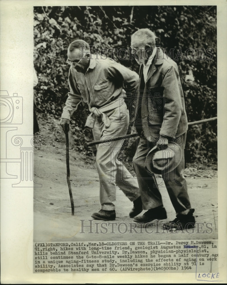 1964 Dr. Percy Dawson hikes with friend Augustus Locke in hills - Historic Images