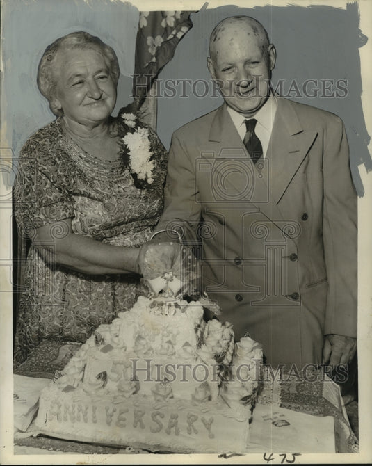 1959 Mr. & Mrs. Henry C. DeBetta cut their 50th anniversary cake-Historic Images