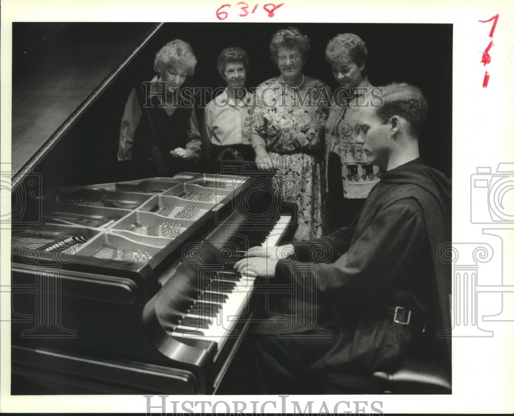 1988 Reverend Sean Duggan Plays Piano for Small Audience - Historic Images