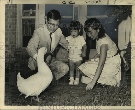 1967 Press Photo Dr. Daniel Juhn & family visit with a people-loving duck. - Historic Images