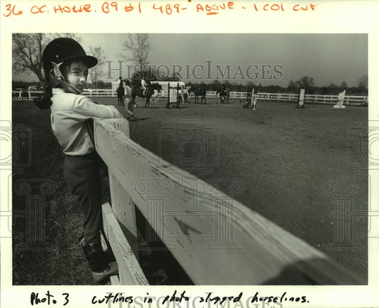 1987 Press Photo A young equestrian waiting her turn to saddle up - noa94715 - Historic Images