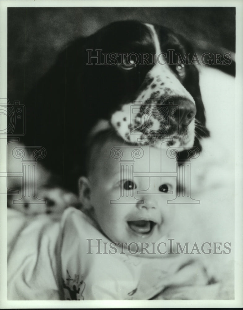 1984 Press Photo Dog and his best friend. - noa95044 - Historic Images