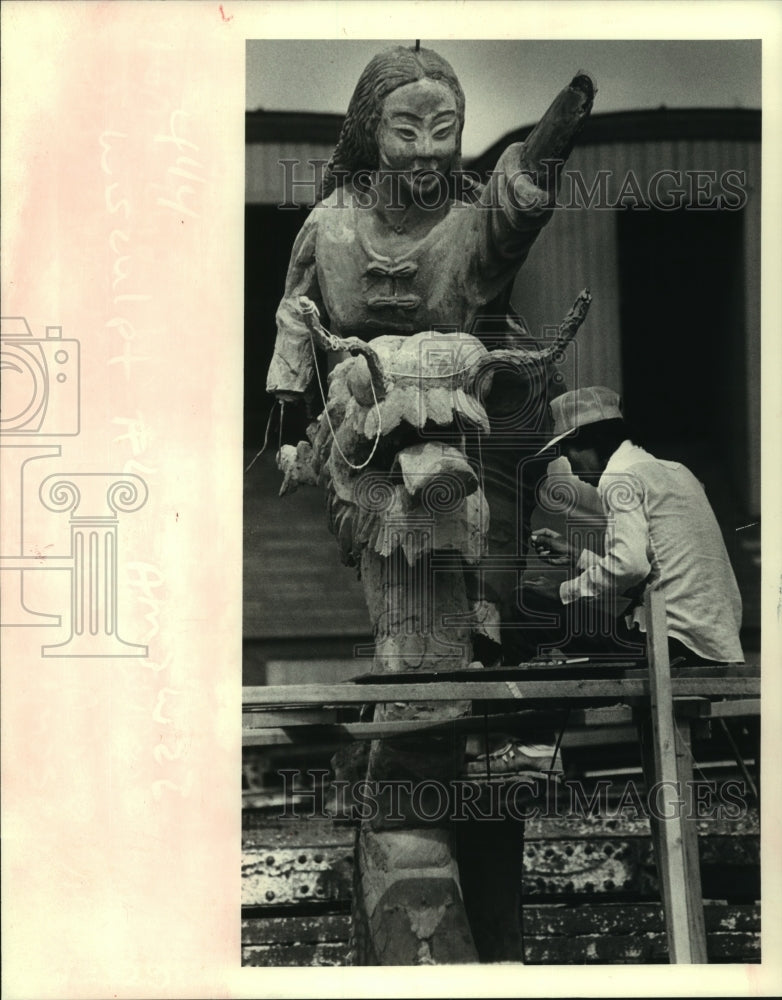 1983 Minh Do scrapes details for Chinese girl sculpture in Metairie - Historic Images