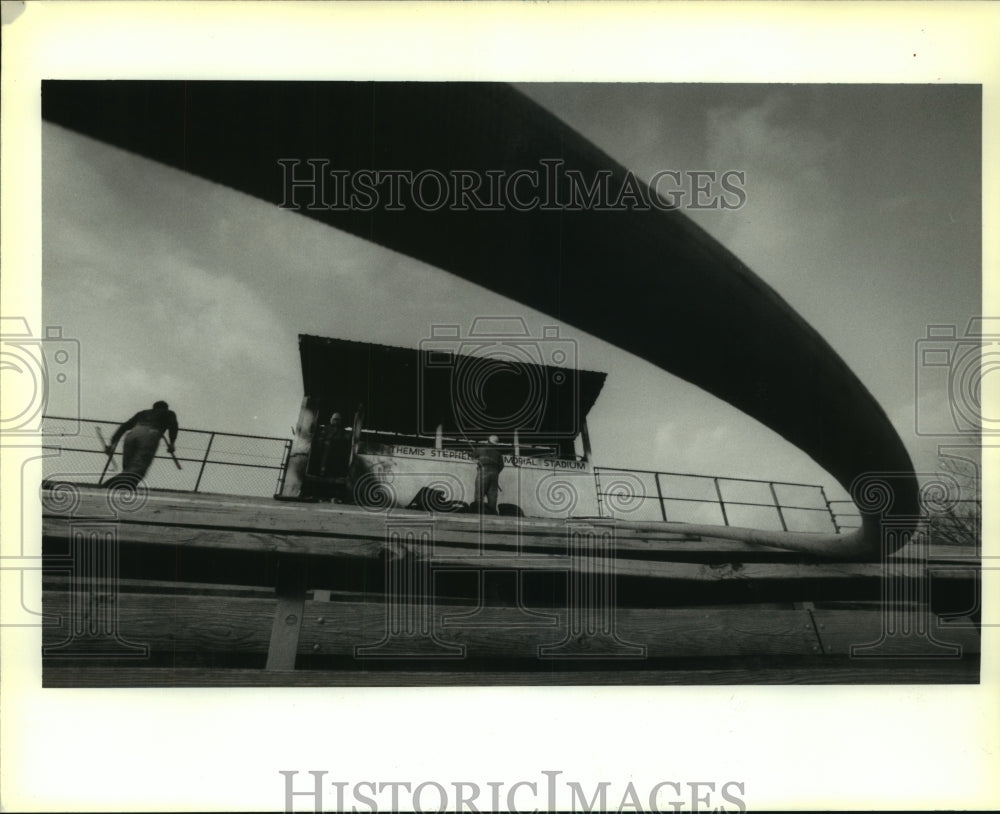 1992 Press Photo Firemen mop up after fire at Ecole Classique school pressbox - Historic Images