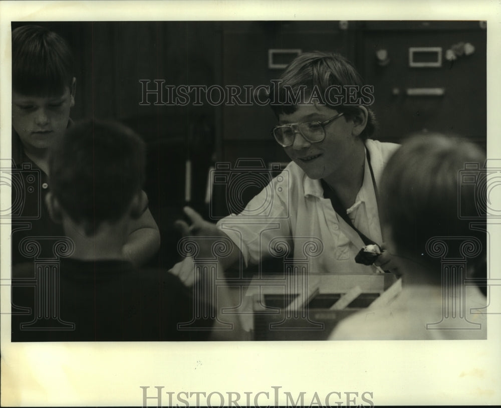 1990 Press Photo Todd Dupuy, 7th Grade Library Assistant - noa96463 - Historic Images