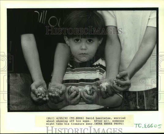 1992 Press Photo David hesitates to show off his Easter eggs - noa97567 - Historic Images