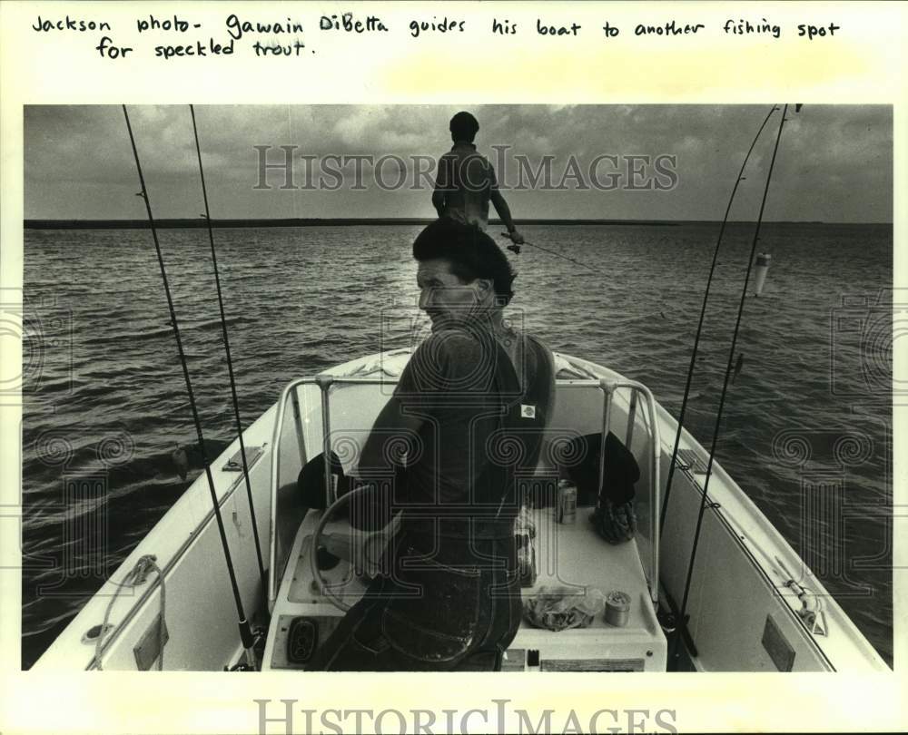 Press Photo Gawain DiBetta guides boat to fishing spot for speckled trout - Historic Images