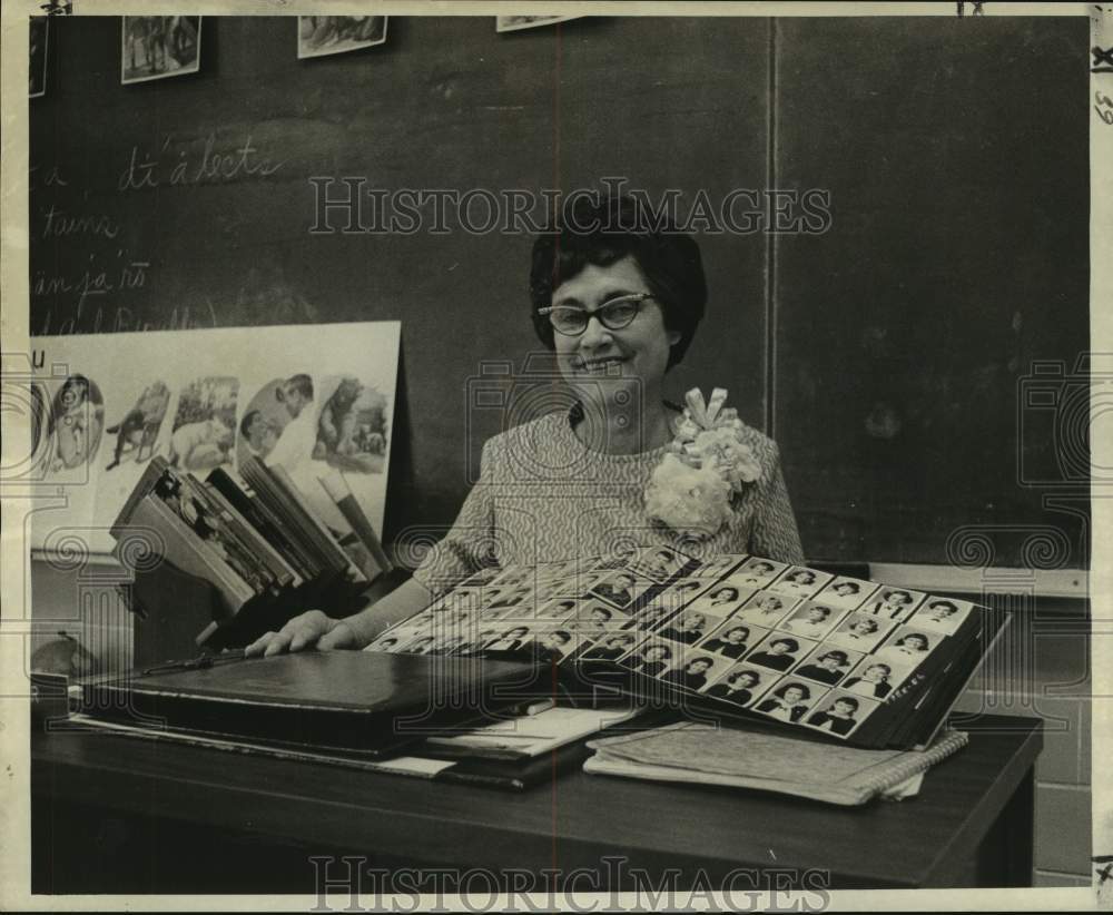 1974 Mrs. Rosemary Eber of St. Cecilia School shows her scrapbooks - Historic Images