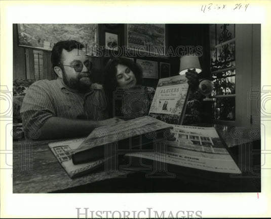 1991 Press Photo Richard R. Dixon's Children Look Over His Book on Algiers - Historic Images