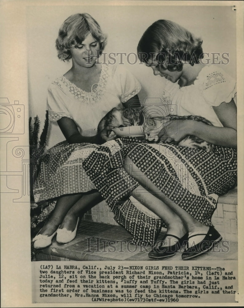 1960 Press Photo Patricia and Julie Nixon feed their kittens on the back porch. - Historic Images