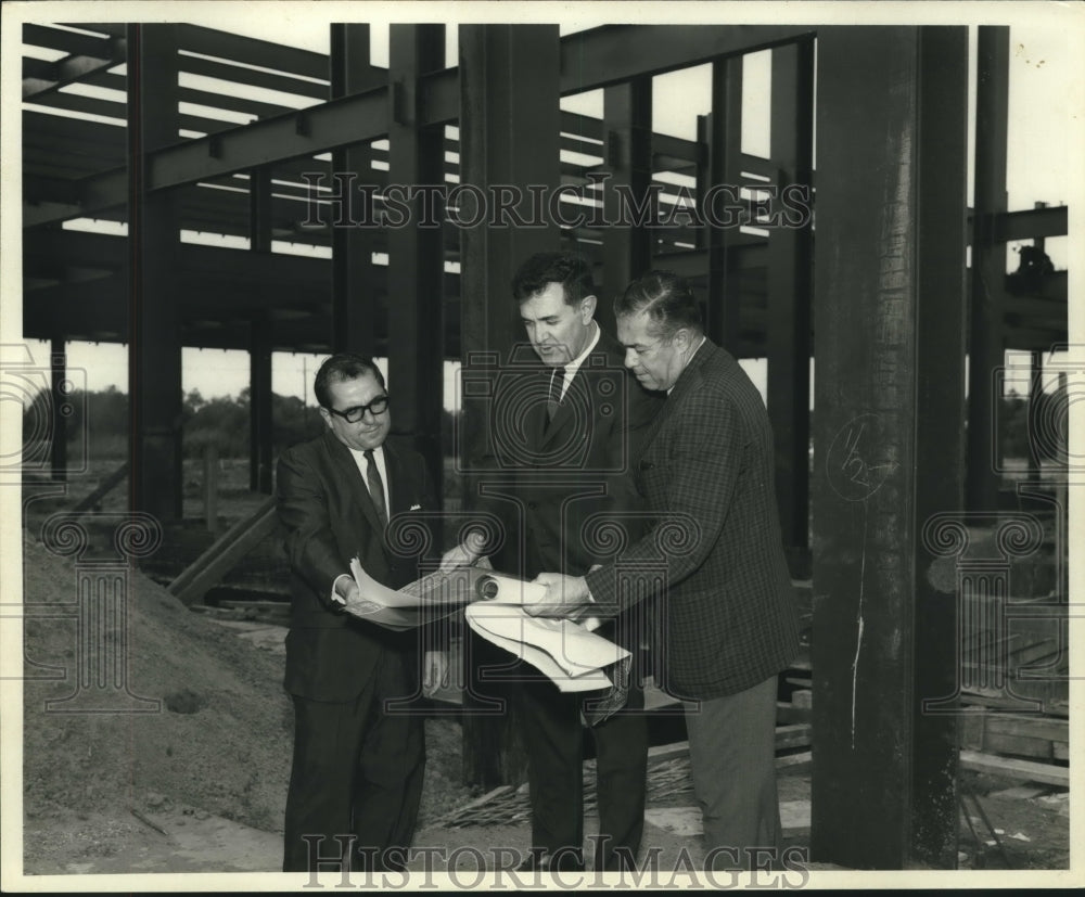 1968 Delegates examine blueprint of East Jefferson General Hospital - Historic Images