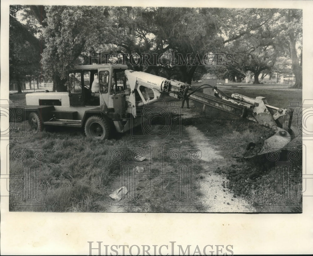 1970 Backhoe digging to save the oak trees, Chalmette - Historic Images