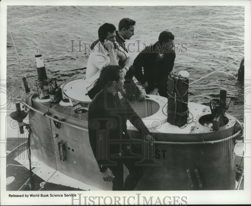 1969 Flight Recorder atop submarine Deep Quest with sub&#39;s crew. - Historic Images