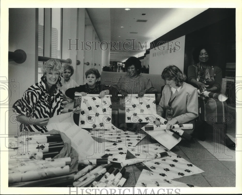 1988 Press Photo Volunteers roll posters for Dollars for Scholars - nob01386 - Historic Images