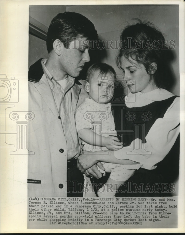 1965 Mr. &amp; Mrs. Ellison hold Tiffany at police station in California - Historic Images