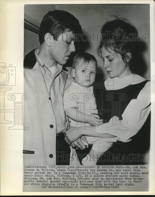 1965 Mr. & Mrs. Ellison hold Tiffany at police station in California - Historic Images