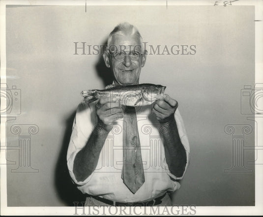1958 Press Photo Amadee Esquire holding a "Golden Gill" fish he caught - Historic Images