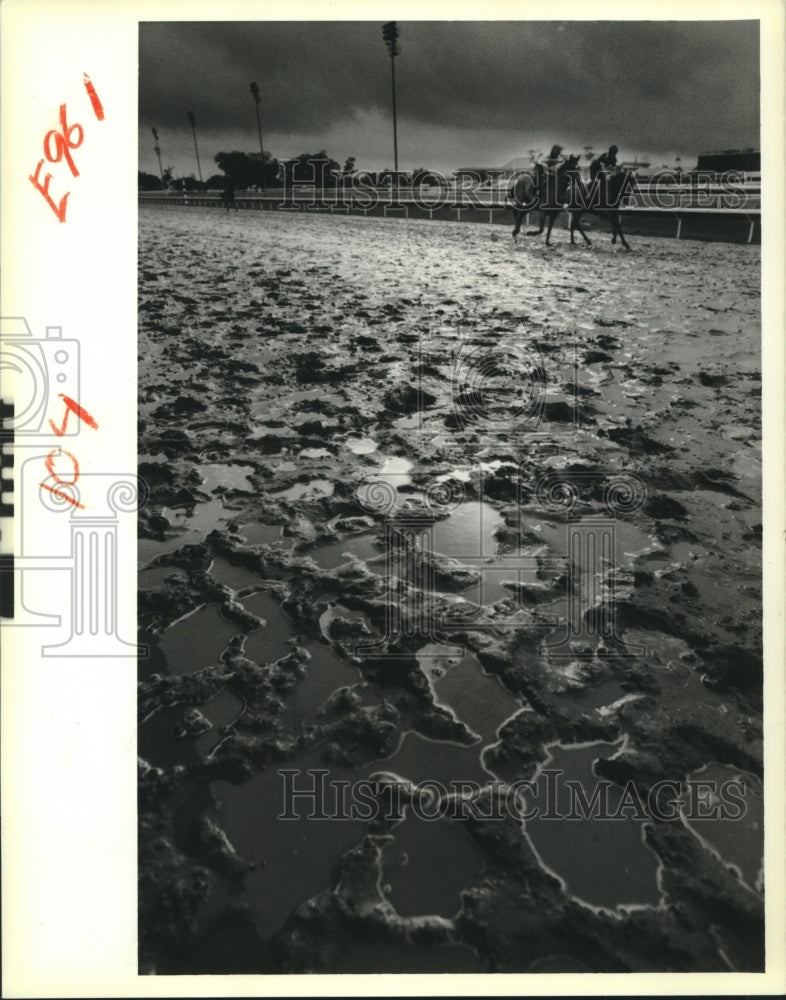 1988 Press Photo Fair Grounds dirt track turns contiguous puddle after storm - Historic Images