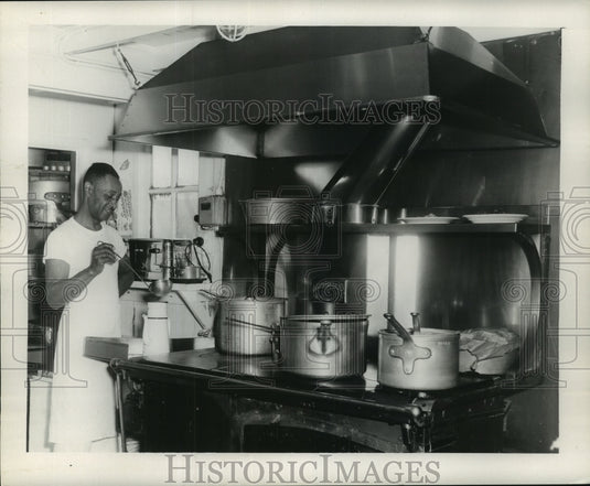 1957 Press Photo William Gay, Cook, brewing something they identify as "coffee" - Historic Images