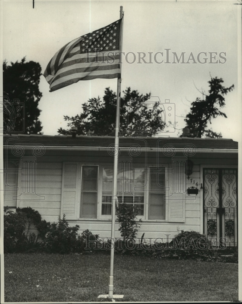 1969 American flag on display at home of 4716 Plauche Circle - Historic Images