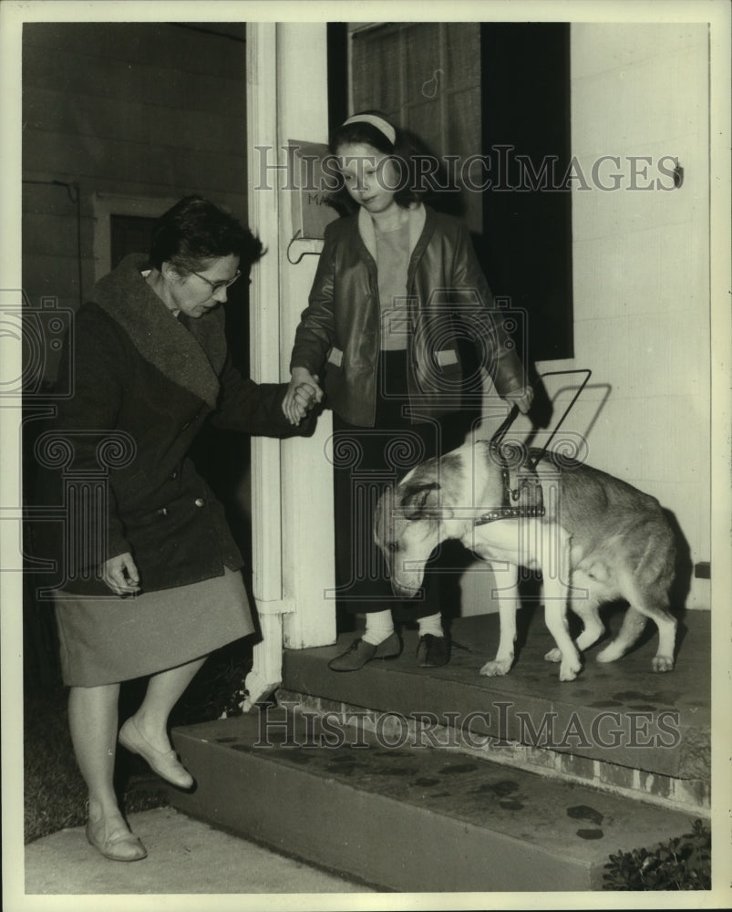 1963 Press Photo Doctor assists blind student down steps with seeing eye dog-Historic Images