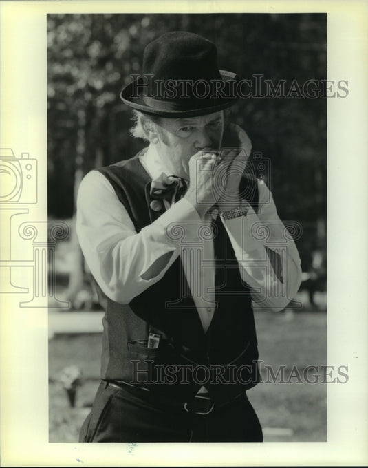 1990 Press Photo Mickey Forrester, plays harmonica during "Grand Situations" - Historic Images