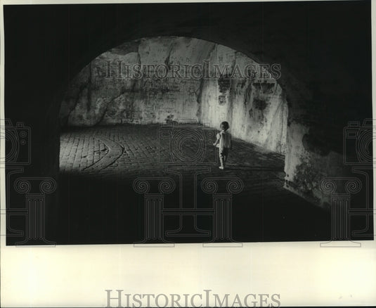 1969 Press Photo Small child walks through tunnels of Fort Pike. - nob06544 - Historic Images