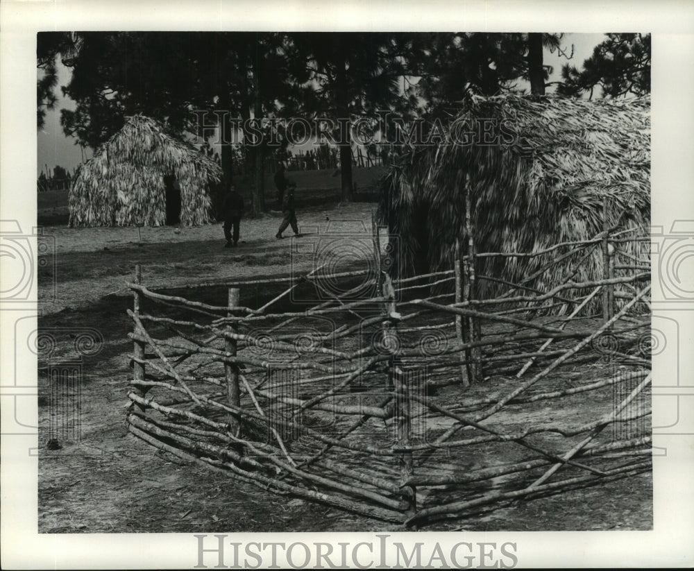 1966 Press Photo A corral and straw buildings inside historic Ft. Pike. - Historic Images